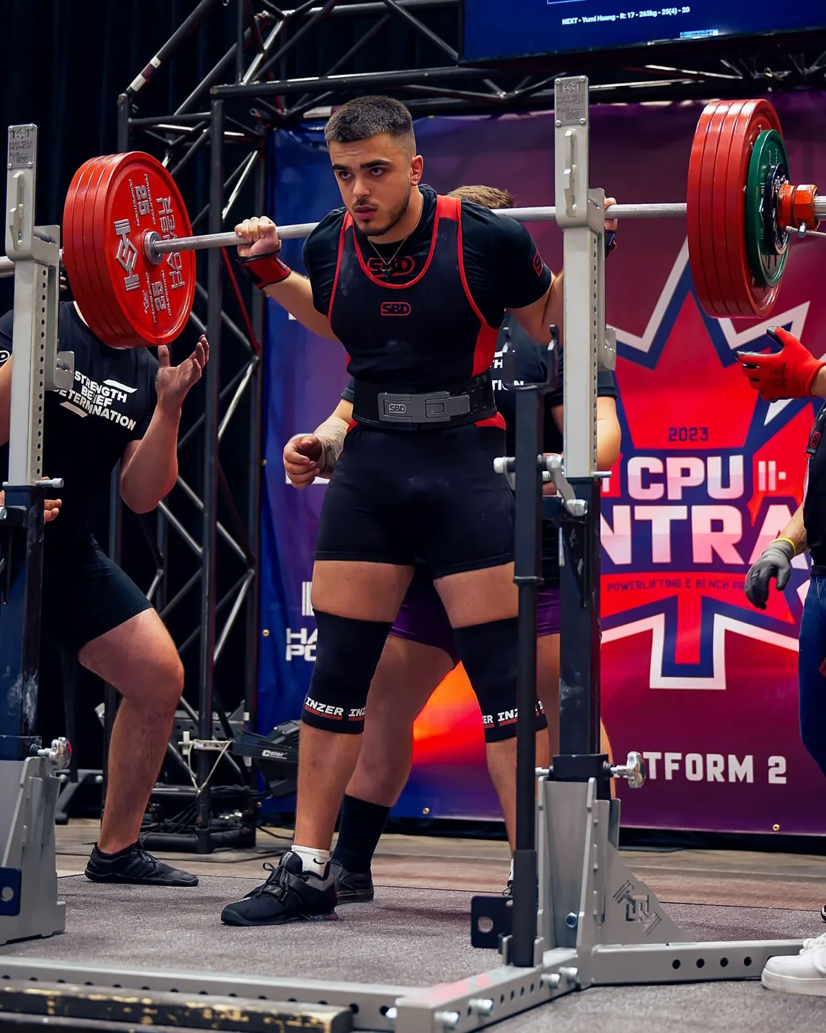 Coach Adam Voutier competing in powerlifting